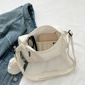 Cream white waterproof nylon dumpling bag with adjustable strap and coin purse