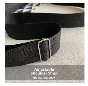 Detail of adjustable black fiber strap with a polished silver metal buckle for crossbody bag