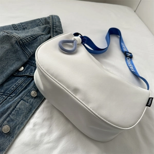 White crescent crossbody bag with blue braided strap featuring Fashion Bag text