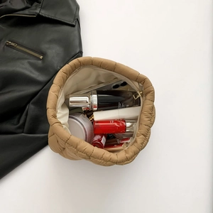Stylish khaki quilted puffer clutch bag showing high capacity for daily cosmetics