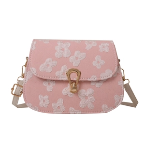 Pink crossbody bag with floral embroidery and gold shield clasp for women fashion