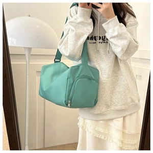 Mint green waterproof sports bag with large capacity for gym and travel use