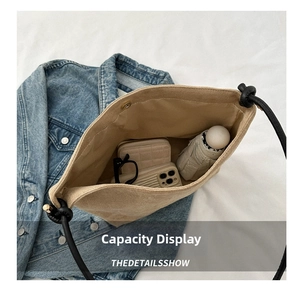Top view of spacious matte tote bag interior showing phone, wallet and umbrella