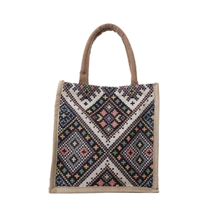 Ethnic style woven tote bag featuring colorful geometric patterns and sturdy top handles