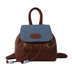 Mini vintage backpack in brown faux leather and blue denim with beaded drawstring
