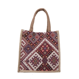 Bohemian tote bag featuring ethnic geometric patterns in red and navy woven fabric