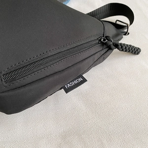 Black Oxford cloth crossbody bag with smooth zipper and fashion tag for women