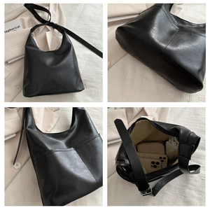 Detailed views of a black tote bag showing the spacious interior and wide shoulder strap