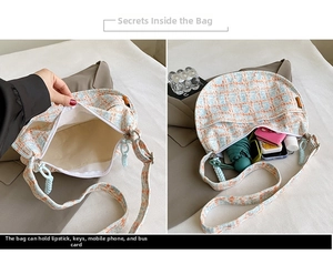 Detailed view of the plaid crossbody bag interior showing storage space for daily items