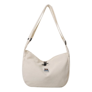 White corduroy crescent crossbody bag with cartoon bear patch and adjustable strap