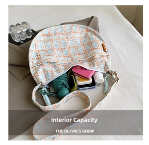 Internal capacity of colorful plaid hobo bag showing space for phone and wallet