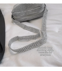 Close-up of sparkling silver rhinestone mini crossbody bag with smooth long shoulder strap