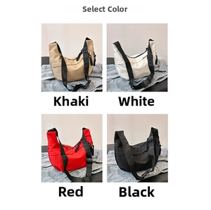 Selection of large nylon crescent bags in khaki, white, red, and black with wide straps