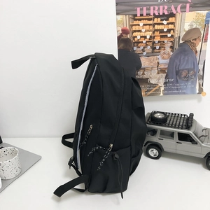 Minimalist black lightweight travel backpack with large capacity and multi-layer storage