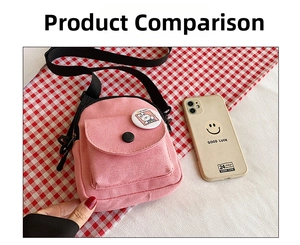 Pink canvas crossbody phone bag shown with a mobile phone to demonstrate its mini size