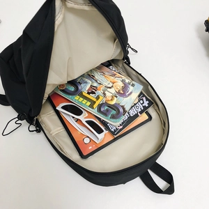 Minimalist black lightweight nylon backpack showing large capacity main compartment