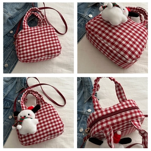 Detail of red and white plaid crossbody bag with cute puppy pendant in four angles