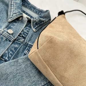 Chic frosted suede half-moon bucket bag in khaki with black knotted shoulder strap