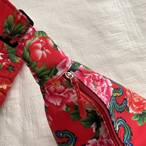 Quilted red canvas crossbody bag with traditional Chinese peony floral and dragon patterns