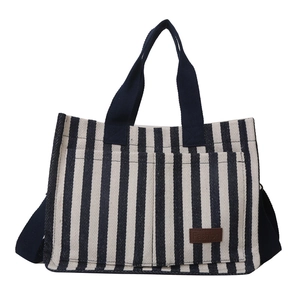 Navy and white striped canvas tote bag with leather logo tag and shoulder strap