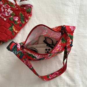 Ethnic floral canvas crescent bag showing spacious interior with everyday essentials