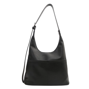 Minimalist black crescent tote bag with smooth synthetic leather and front pocket detail