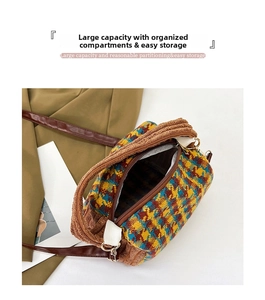 Detailed view of plaid wool handbag with brown faux fur trim and leather shoulder strap