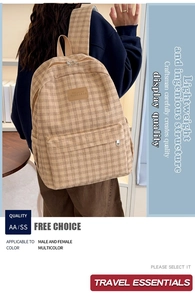 Close-up of khaki corduroy school backpack with front pocket and logo detail