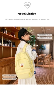 Detail of yellow canvas backpack with fashion patch in a cozy cafe setting