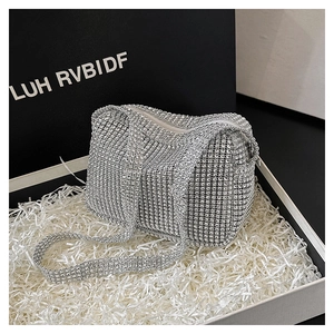 Close-up of a sparkling silver rhinestone evening clutch bag with matching shoulder strap