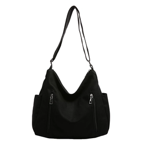 Large black canvas hobo bag with dual silver zippers and adjustable shoulder strap