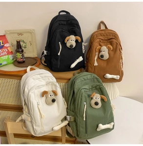 Detailed corduroy backpacks featuring 3D plush puppy and bone motifs in four earthy colors