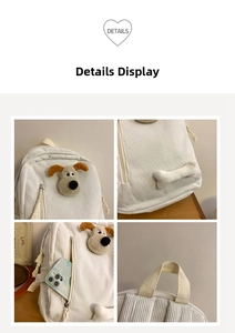 Close-up of white corduroy backpack with plush puppy character and 3D bone detail
