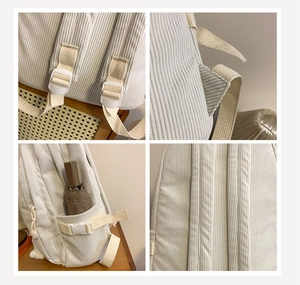 Detail view of corduroy backpack showing adjustable straps and side pocket with umbrella