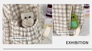 Detail of checkered corduroy backpack featuring elastic side pocket and anti-theft back pocket
