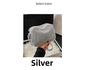 Detail view of silver rhinestone handbag with sparkling crystals in a white gift box
