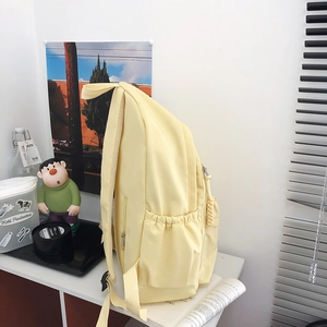 Sac à dos en nylon jaune clair de grande capacité avec poches latérales et cordons
