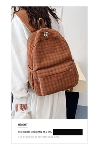 Brown corduroy backpack featuring leather logo detail shown on a model height 165cm