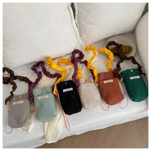 Women's corduroy crossbody phone bags in various colors with stylish pleated straps