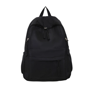 Minimalist black nylon backpack for students featuring woven rope zipper pulls on white background