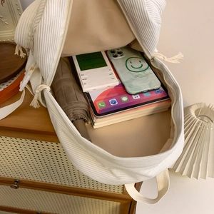 White corduroy backpack with large capacity interior for students and school accessories