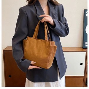 Brown corduroy shoulder tote bag with large capacity and side pockets for casual daily use