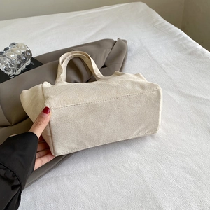 Beige corduroy handbag with textured finish for women, elegant commuter style bag