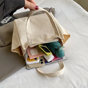 Spacious beige corduroy tote bag showing large capacity for tablet and daily items