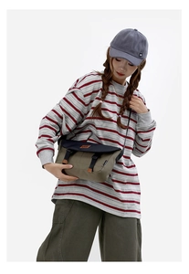 Detail of trendy color-block messenger bag with adjustable buckle straps and canvas texture