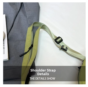 Close-up of adjustable nylon shoulder strap with a zipper pocket on light green bag