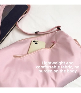 Detail of pink travel bag with exterior zipper pocket for smartphone storage