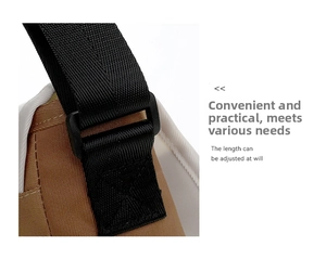Detail of adjustable black nylon shoulder strap with buckle for canvas messenger bag