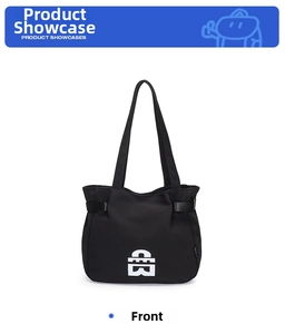 Detailed front view of black canvas tote bag featuring a white geometric logo and side straps
