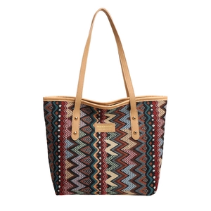 Ethnic woven tote bag with colorful geometric wave patterns and brown leather handles